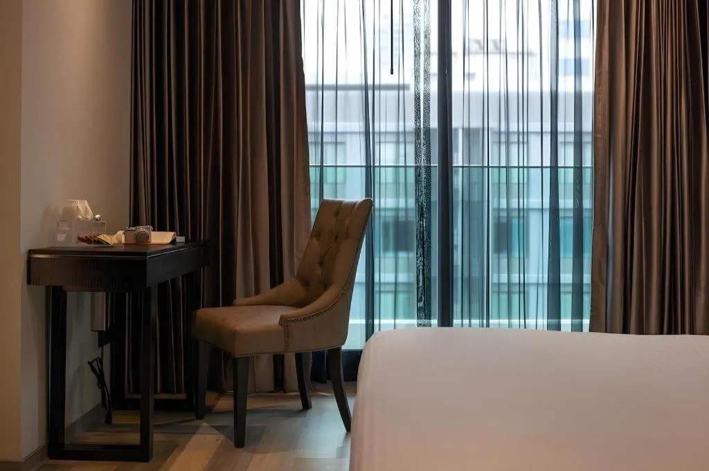 Bed in First Pride Hotel Bangkok