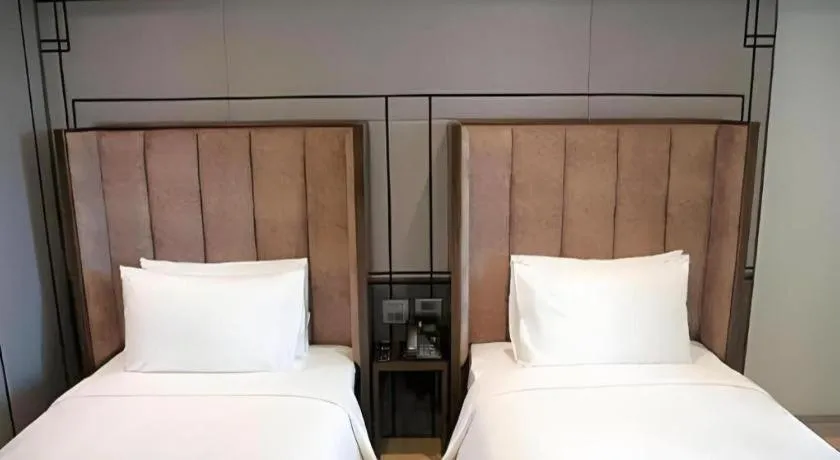 Bed in First Pride Hotel Bangkok
