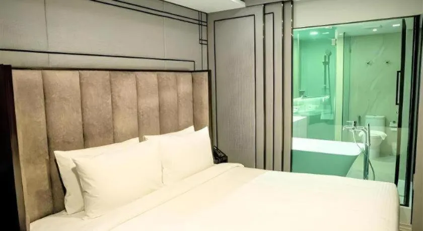 Bed in First Pride Hotel Bangkok