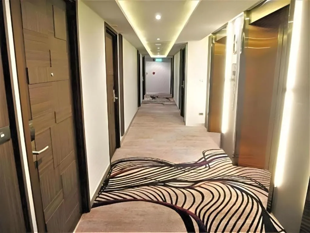 Bed in First Pride Hotel Bangkok