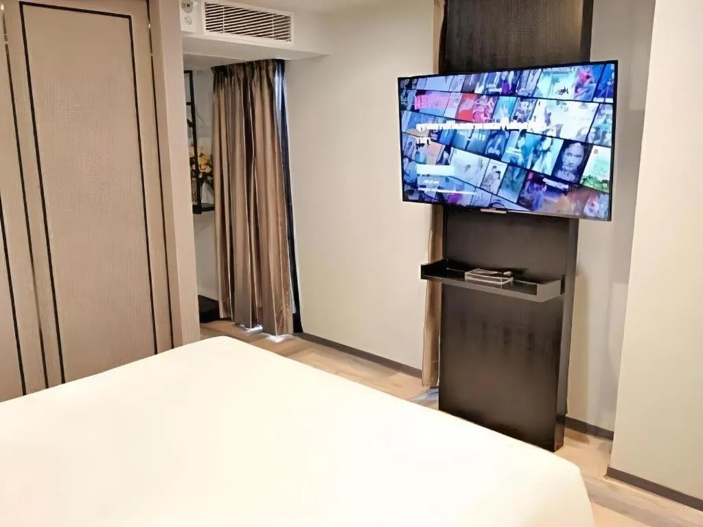 Bed in First Pride Hotel Bangkok