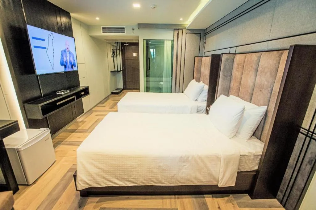 Bed in First Pride Hotel Bangkok