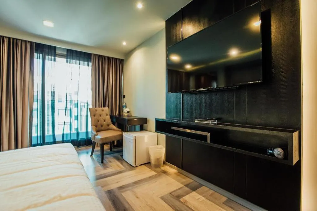 Bed in First Pride Hotel Bangkok