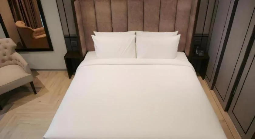 Bed in First Pride Hotel Bangkok