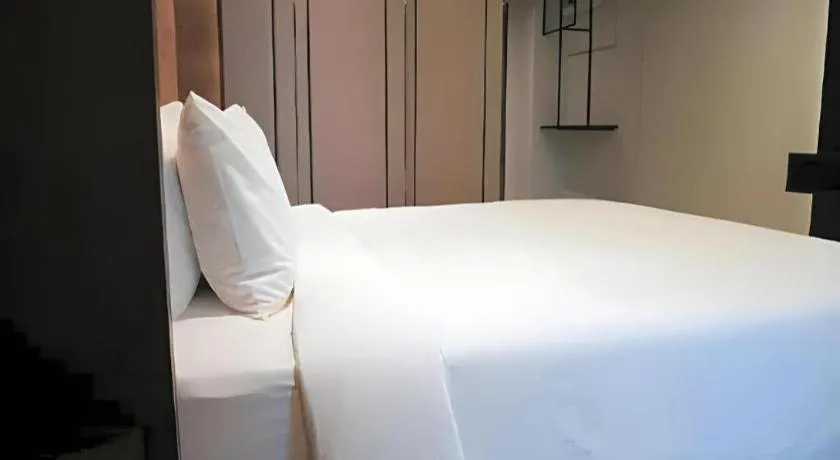 Bed in First Pride Hotel Bangkok