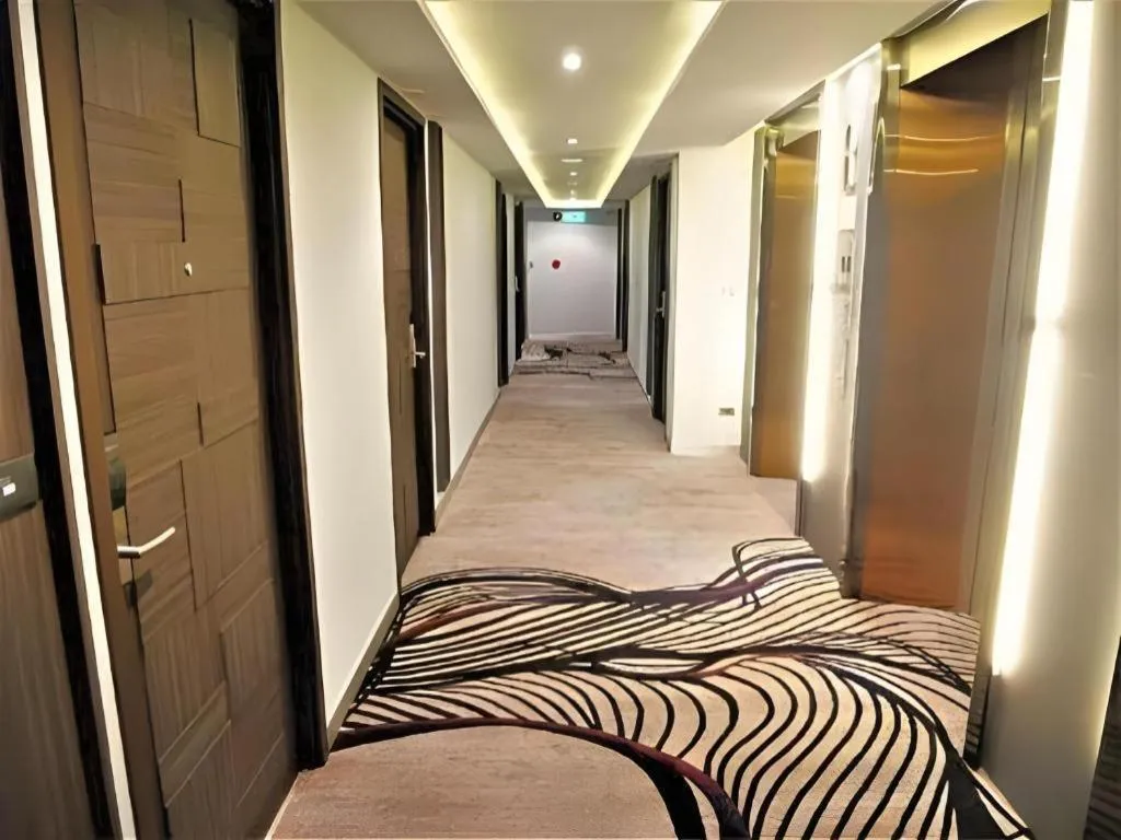 Bed in First Pride Hotel Bangkok