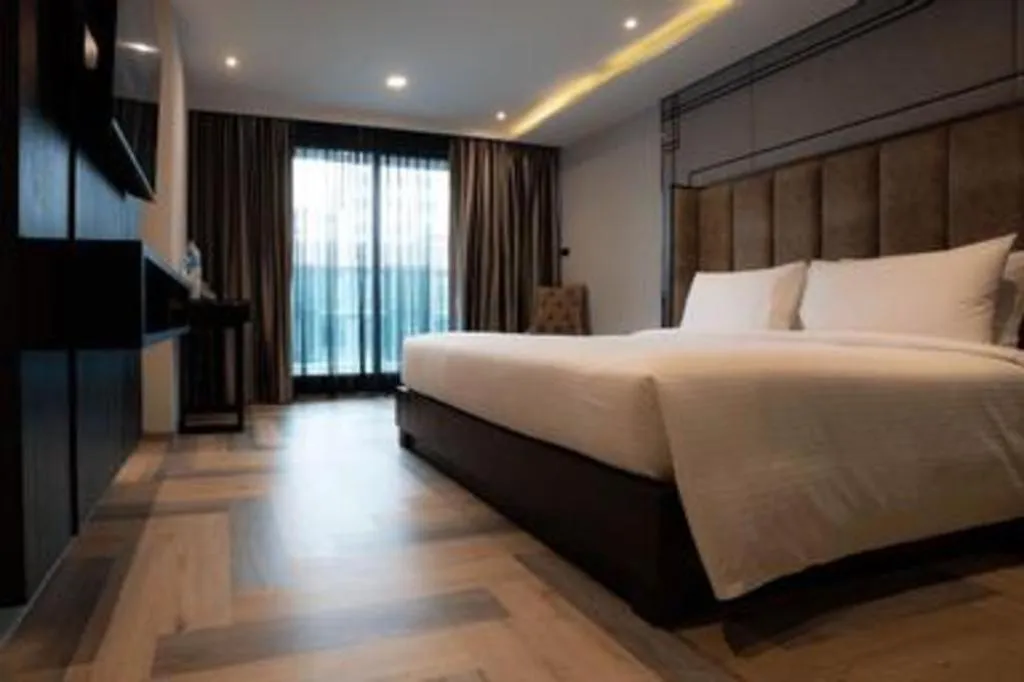 Bed in First Pride Hotel Bangkok