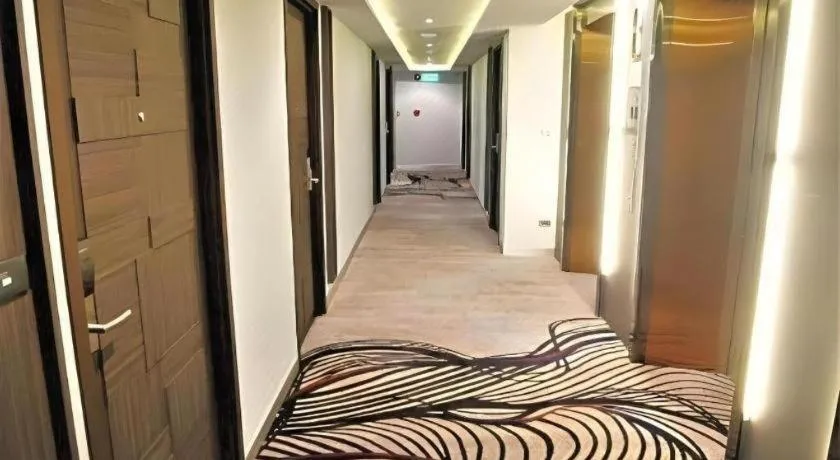 Bed in First Pride Hotel Bangkok