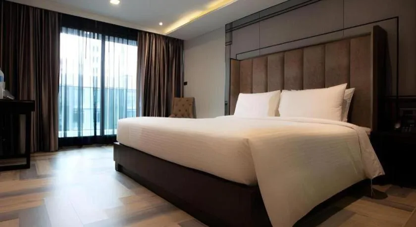 Bed in First Pride Hotel Bangkok
