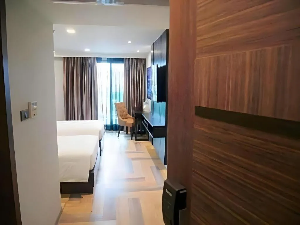 Bed in First Pride Hotel Bangkok