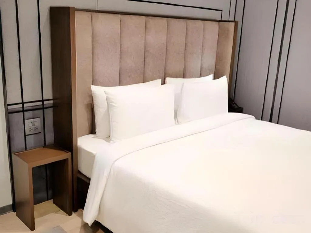 Bed in First Pride Hotel Bangkok