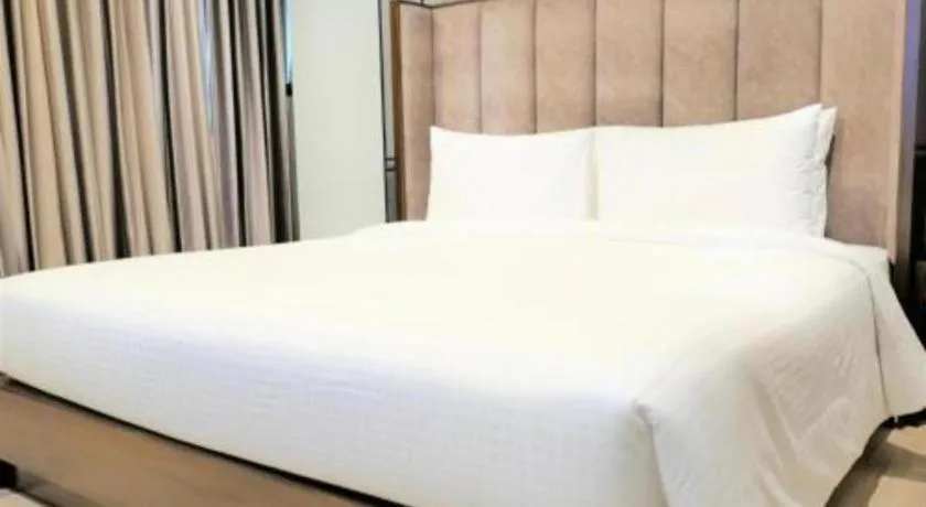 Bed in First Pride Hotel Bangkok