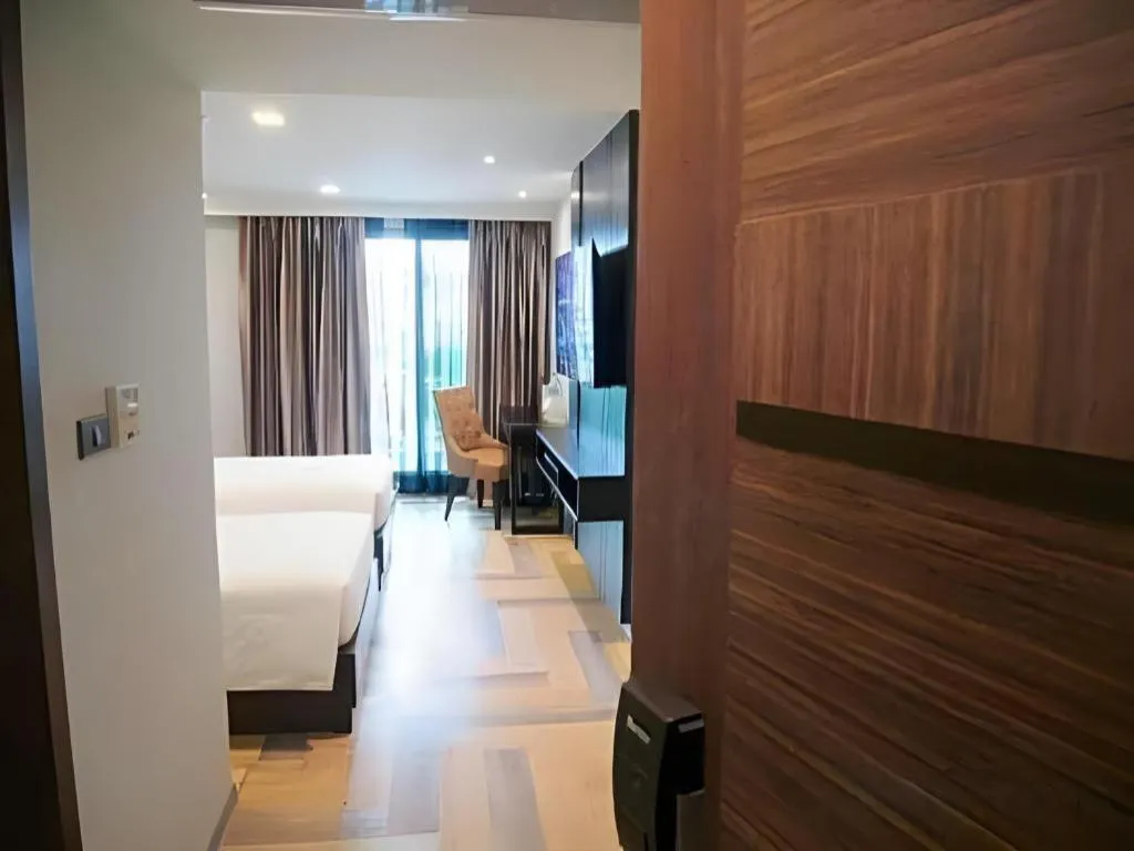 Bed in First Pride Hotel Bangkok