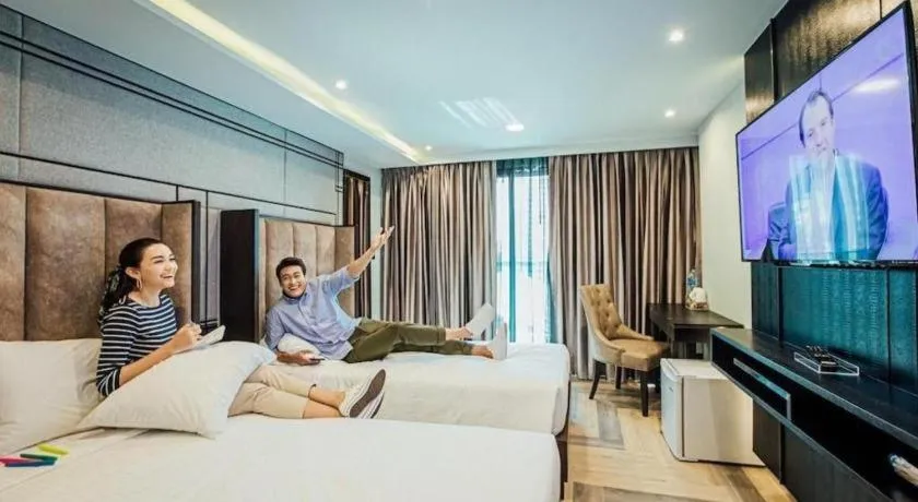 Bed in First Pride Hotel Bangkok