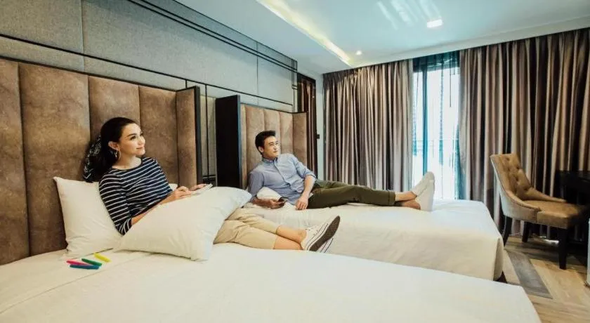 Bed in First Pride Hotel Bangkok