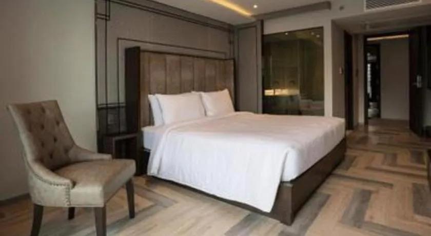 Bed in First Pride Hotel Bangkok