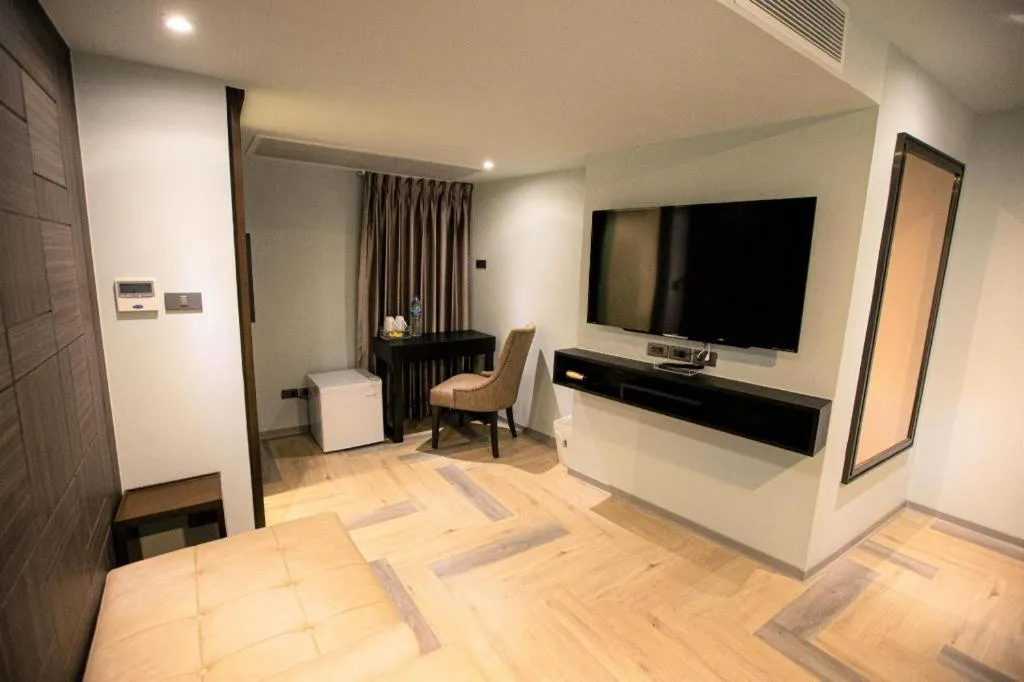 Bed in First Pride Hotel Bangkok