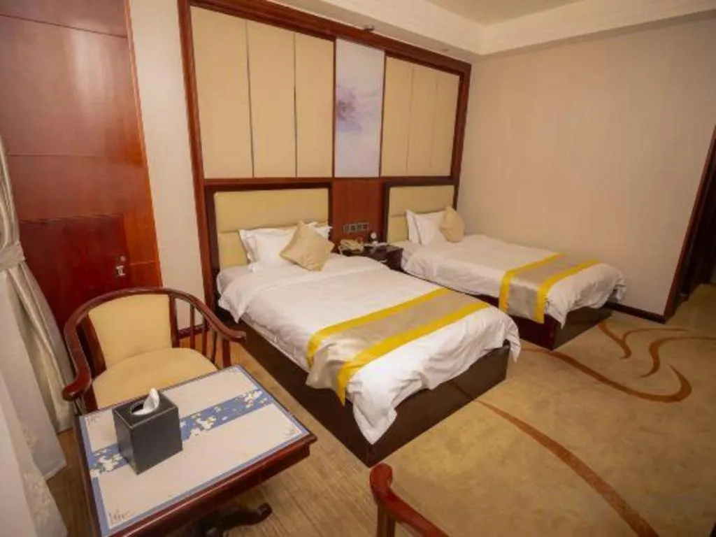 Bed in Grand Szechuan Hotel Vientiane