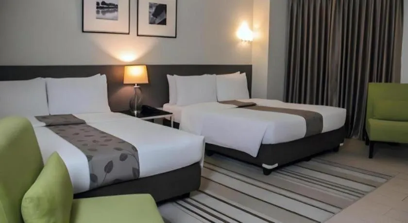 Bed in Sequoia Hotel Quezon City