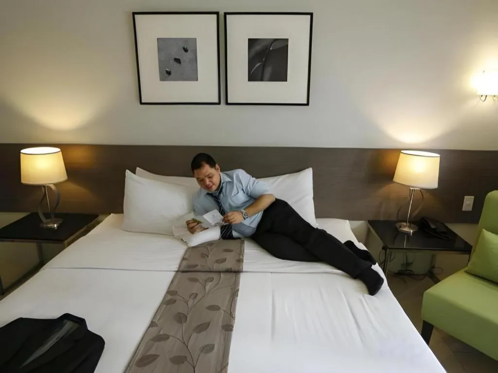 Bed in Sequoia Hotel Quezon City