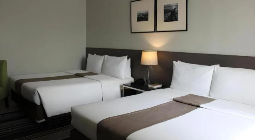 Bed in Sequoia Hotel Quezon City