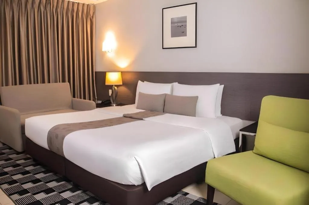 Bed in Sequoia Hotel Quezon City