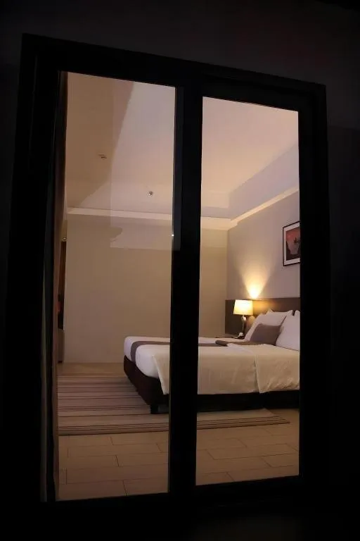 Bed in Sequoia Hotel Quezon City