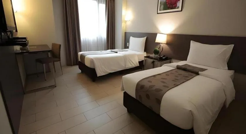 Bed in Sequoia Hotel Quezon City