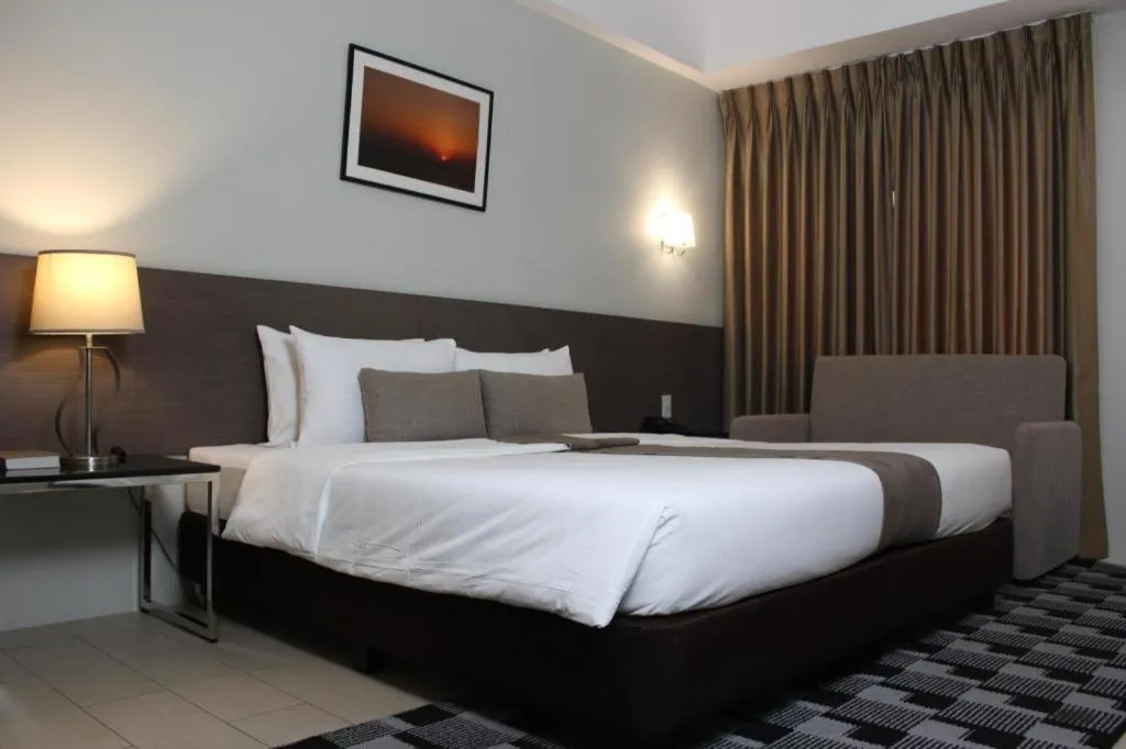 Bed in Sequoia Hotel Quezon City