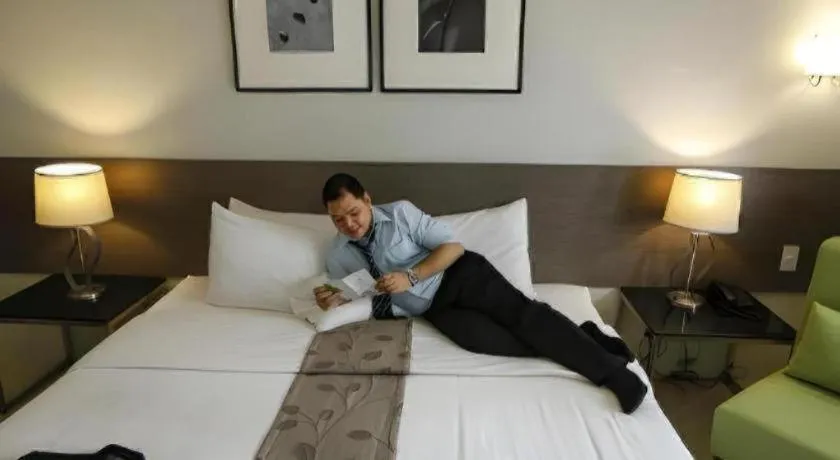 Bed in Sequoia Hotel Quezon City