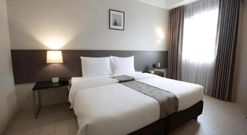 Bed in Sequoia Hotel Quezon City