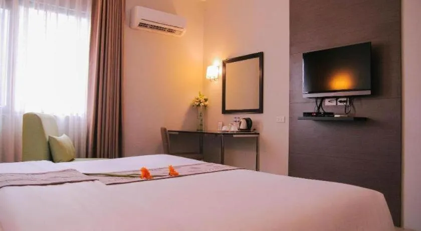 Bed in Sequoia Hotel Quezon City