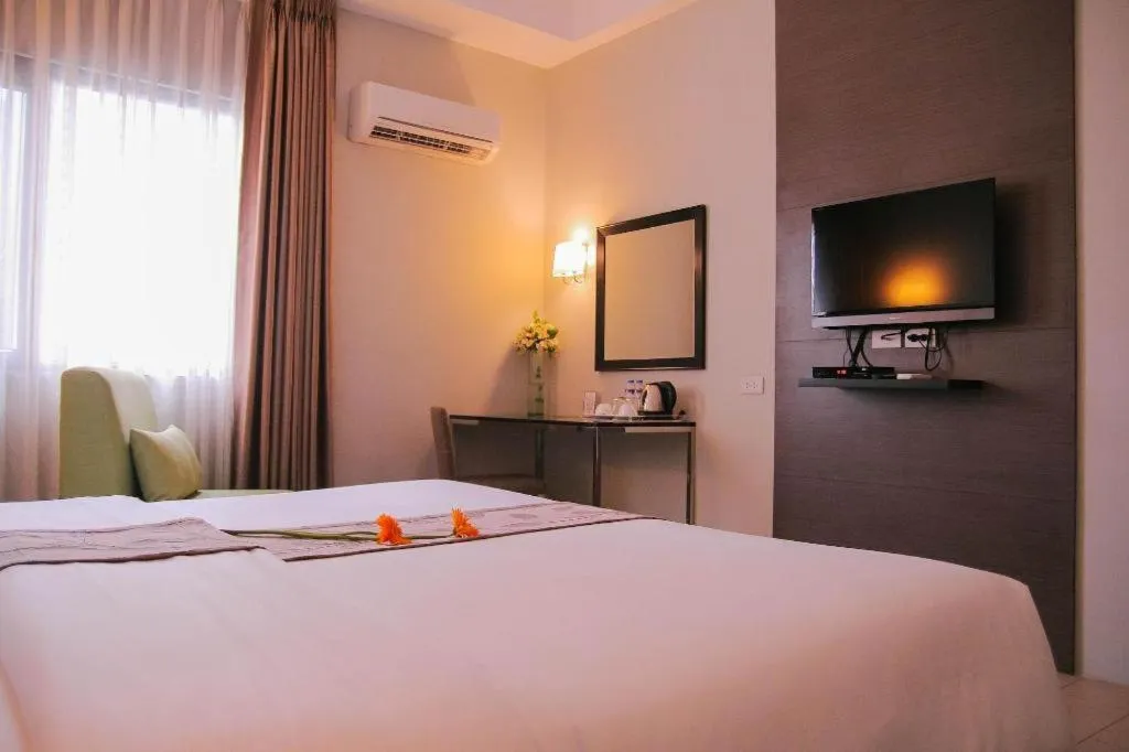 Bed in Sequoia Hotel Quezon City