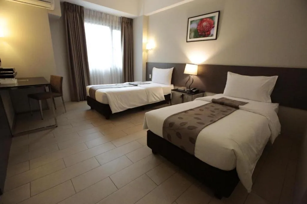 Bed in Sequoia Hotel Quezon City