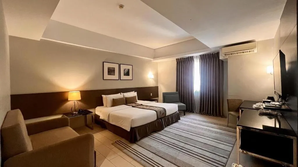 Bed in Sequoia Hotel Quezon City