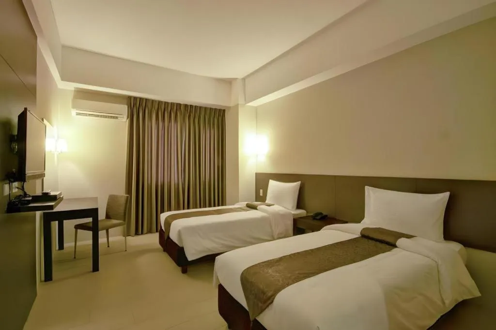 Bed in Sequoia Hotel Quezon City