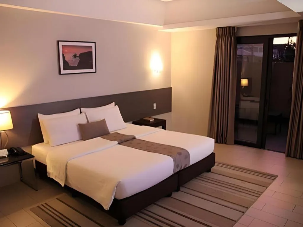 Bed in Sequoia Hotel Quezon City