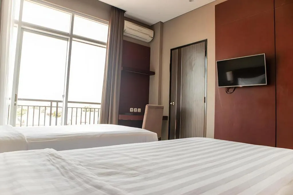 Bed in Karlita Hotel Tegal