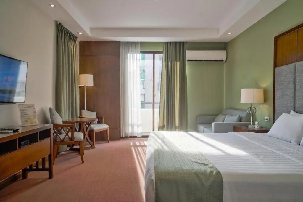 Bed in Mansion Garden Hotel