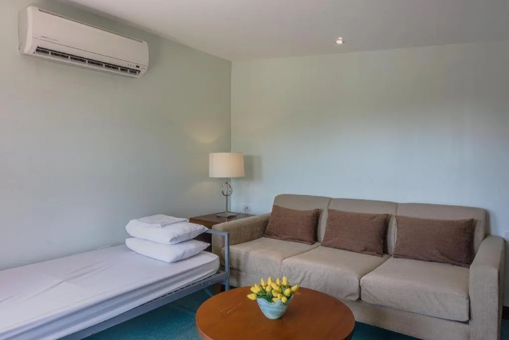 Bed in Mansion Garden Hotel