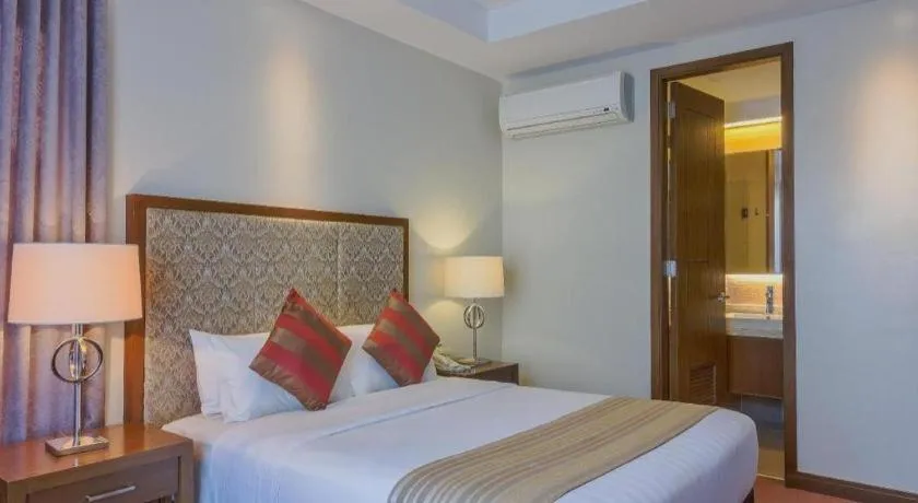 Bed in Mansion Garden Hotel