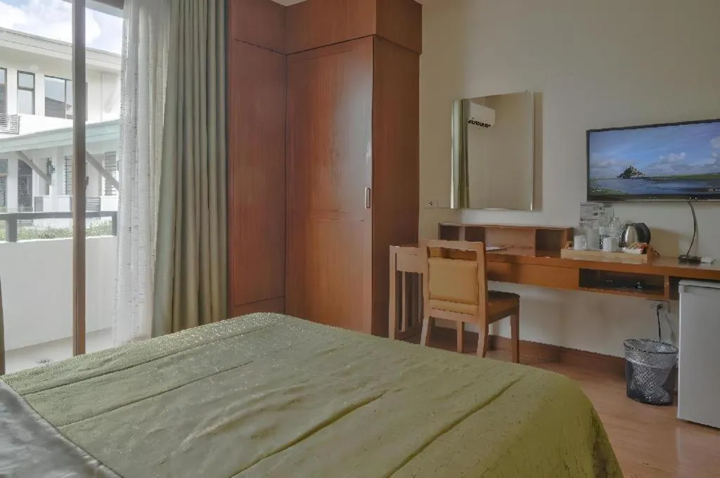 Bed in Mansion Garden Hotel