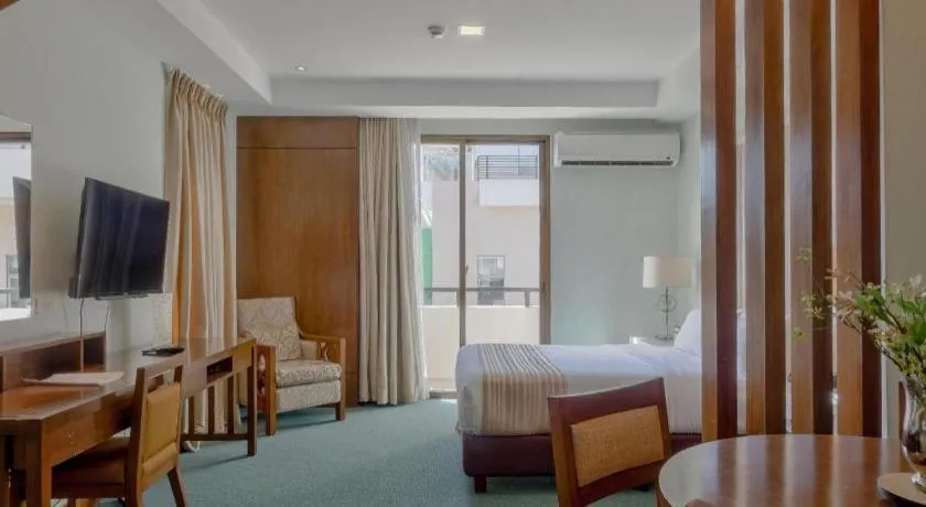 Bed in Mansion Garden Hotel