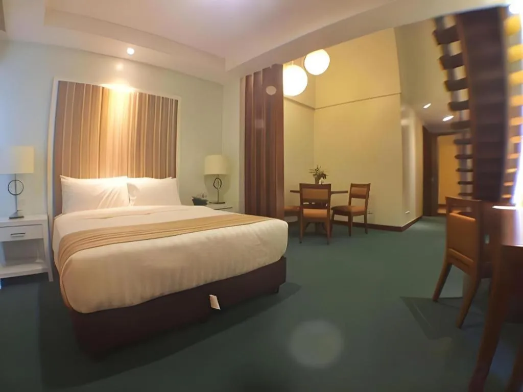 Bed in Mansion Garden Hotel