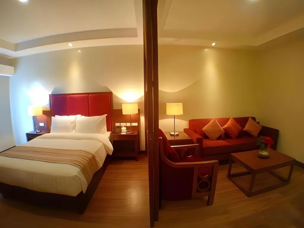 Bed in Mansion Garden Hotel