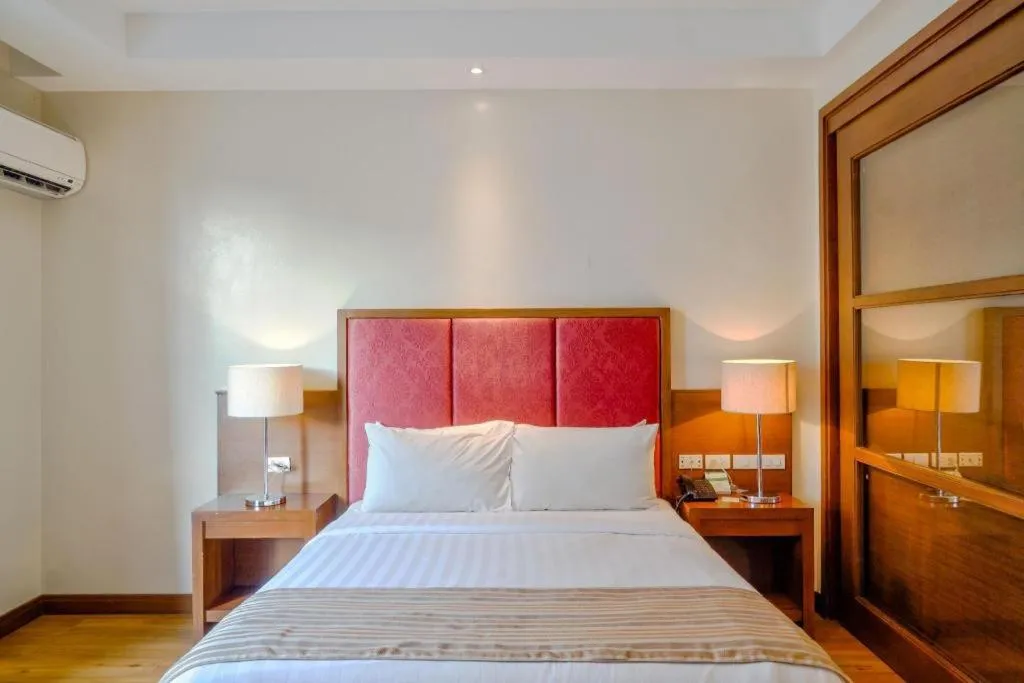 Bed in Mansion Garden Hotel