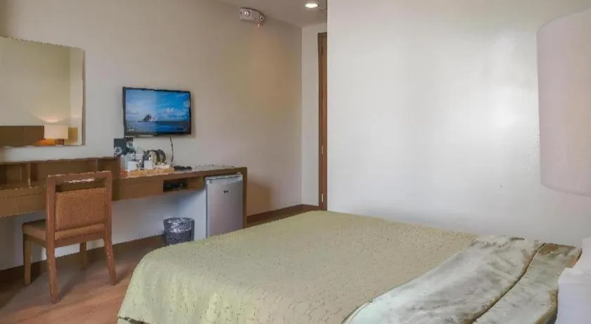 Bed in Mansion Garden Hotel