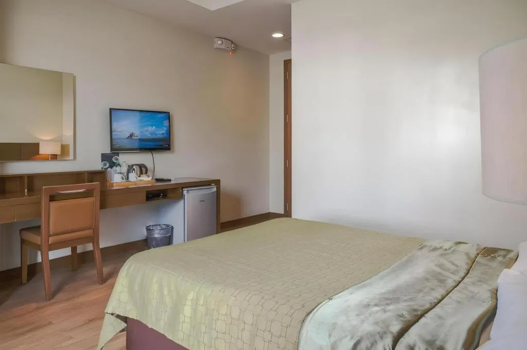 Bed in Mansion Garden Hotel