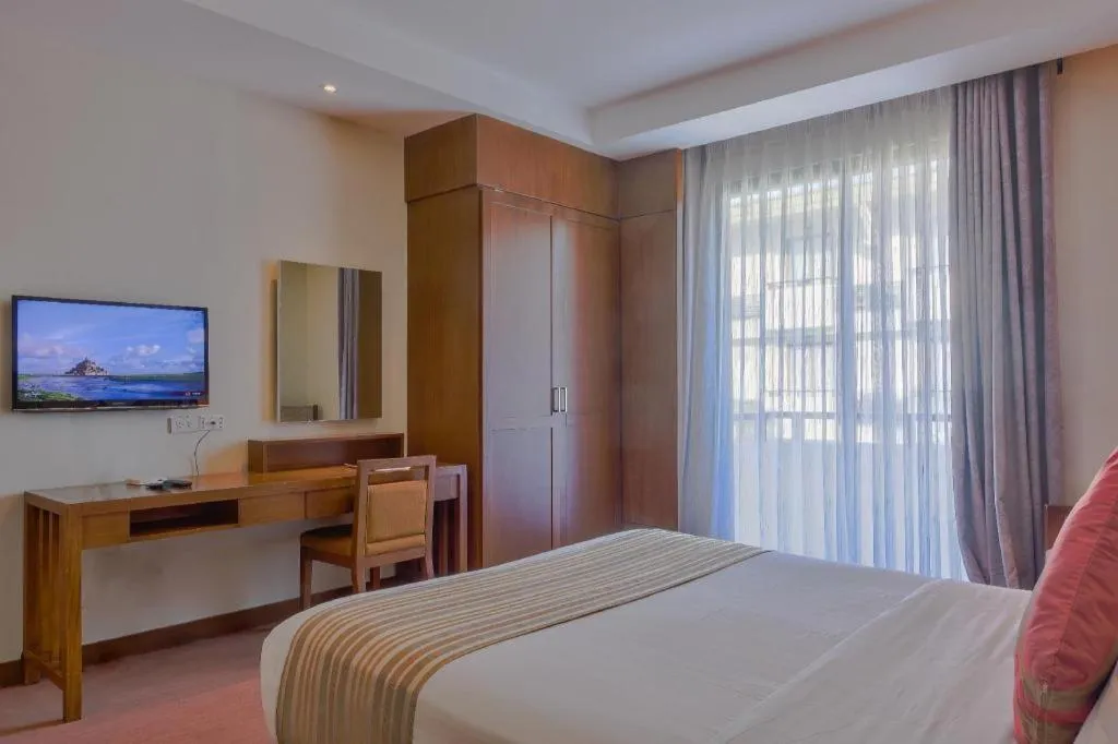 Bed in Mansion Garden Hotel