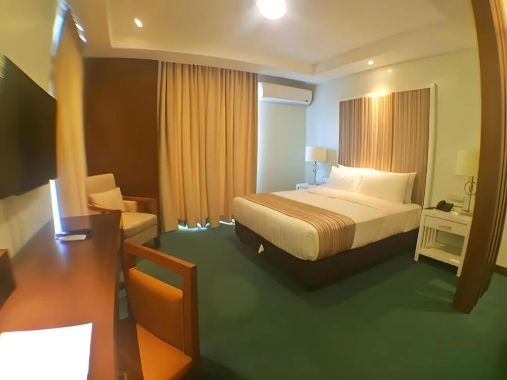 Bed in Mansion Garden Hotel